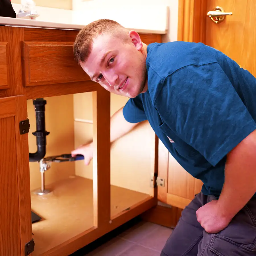 Plumber fixing a bathroom sink