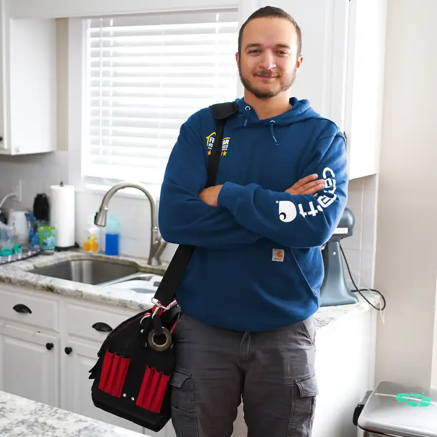 Plumber standing in front of a sink